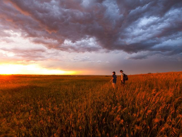 Hikers in the prairie after a thunderstorm near Strawberry Lake, North Dakota.