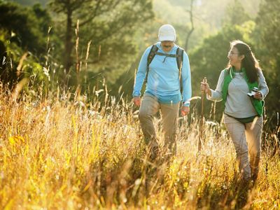 Hikers walking through grassland