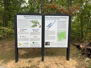 Welcome signs at Hitz-Rhodehamel Woods.