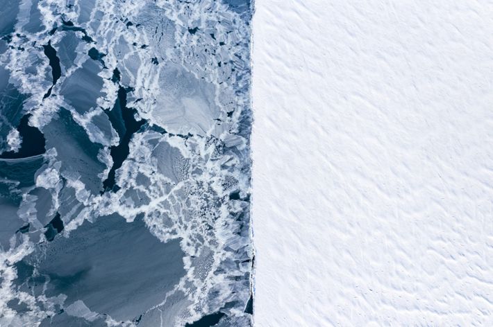 Aerial view of two different types of ice in winter. On the right side, the well established fast ice. On the left, the open water refreezing after a storm took away the ice.