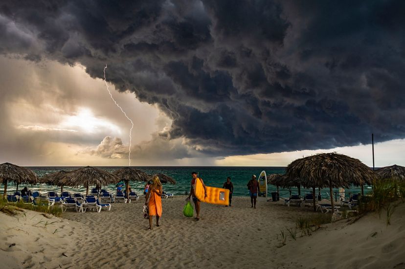 I was at Varadero beach, Cuba when I saw this huge cloud coming, then I ran to the room and brought my camera to capture it.