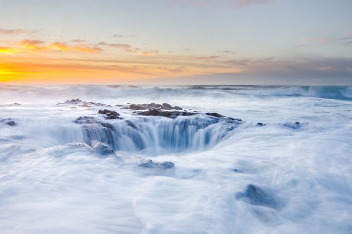 Also known as the Drainpipe of the Pacific, this natural hole in the rock along the Oregon Coast is seen here at sunset.