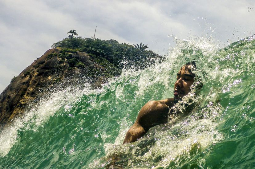 A surfer enjoying a good wave in Copacabana.