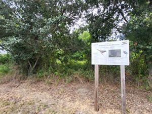 A preserve sign indicates that it is welcoming for bird watchers.