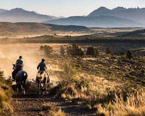 Dawn illuminates a view across an estancia and the Atla