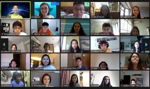 A screen capture of an online webinar that shows many students faces in a grid.
