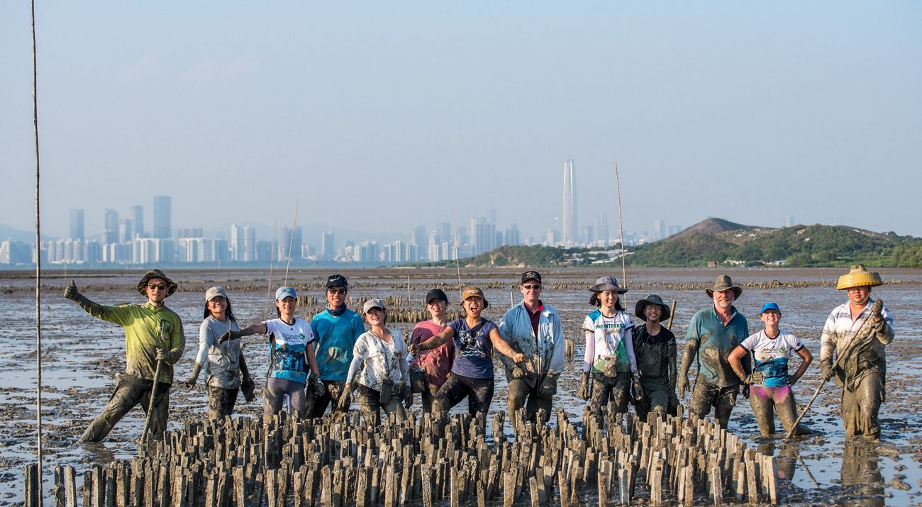 TNC Senior Leaders work together to build five reef structures at Arlington Cove in Mobile Bay, Alabama
