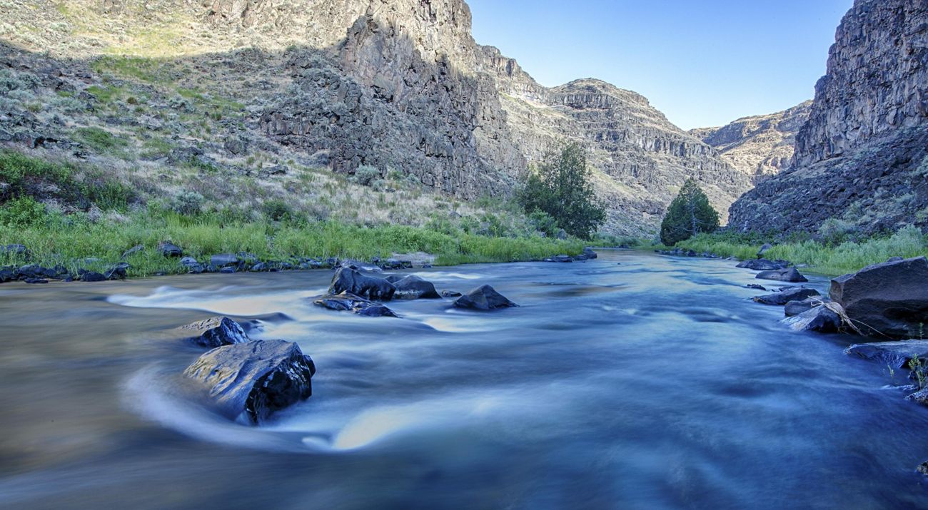 Terraced rocky canyon with the Jarbidge river flowing through.