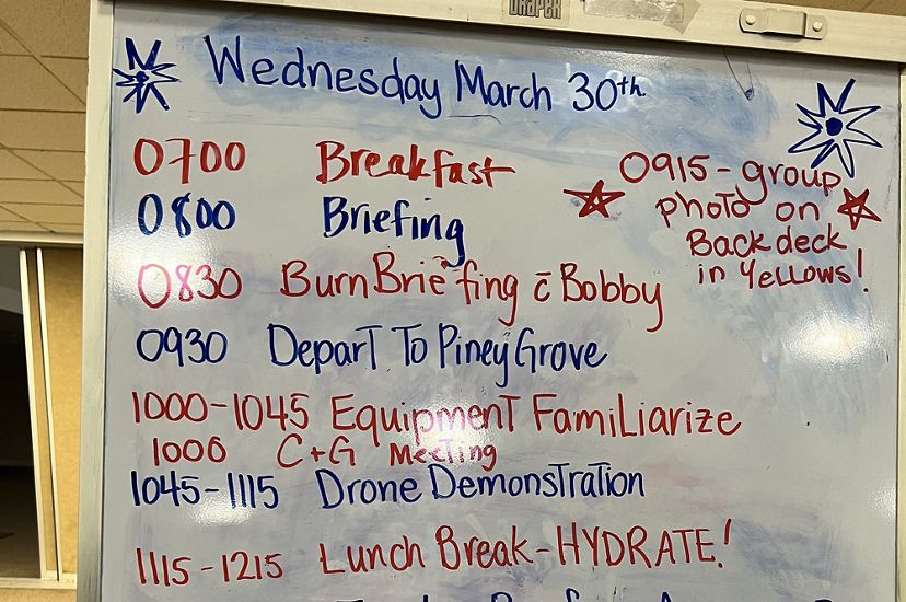 A white board showing the WTREX training schedule for Wednesday, March 30 2022 beginning with breakfast at 7:00 am and ending with dinner and presentations at 7:00 pm.
