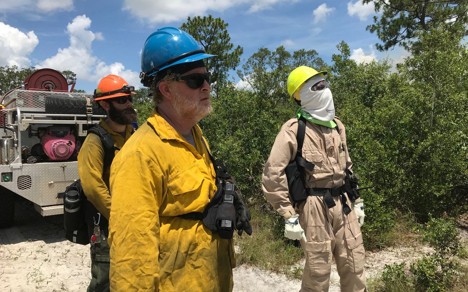 Three fire practitioners oversee the prescribed fire in Florida. 