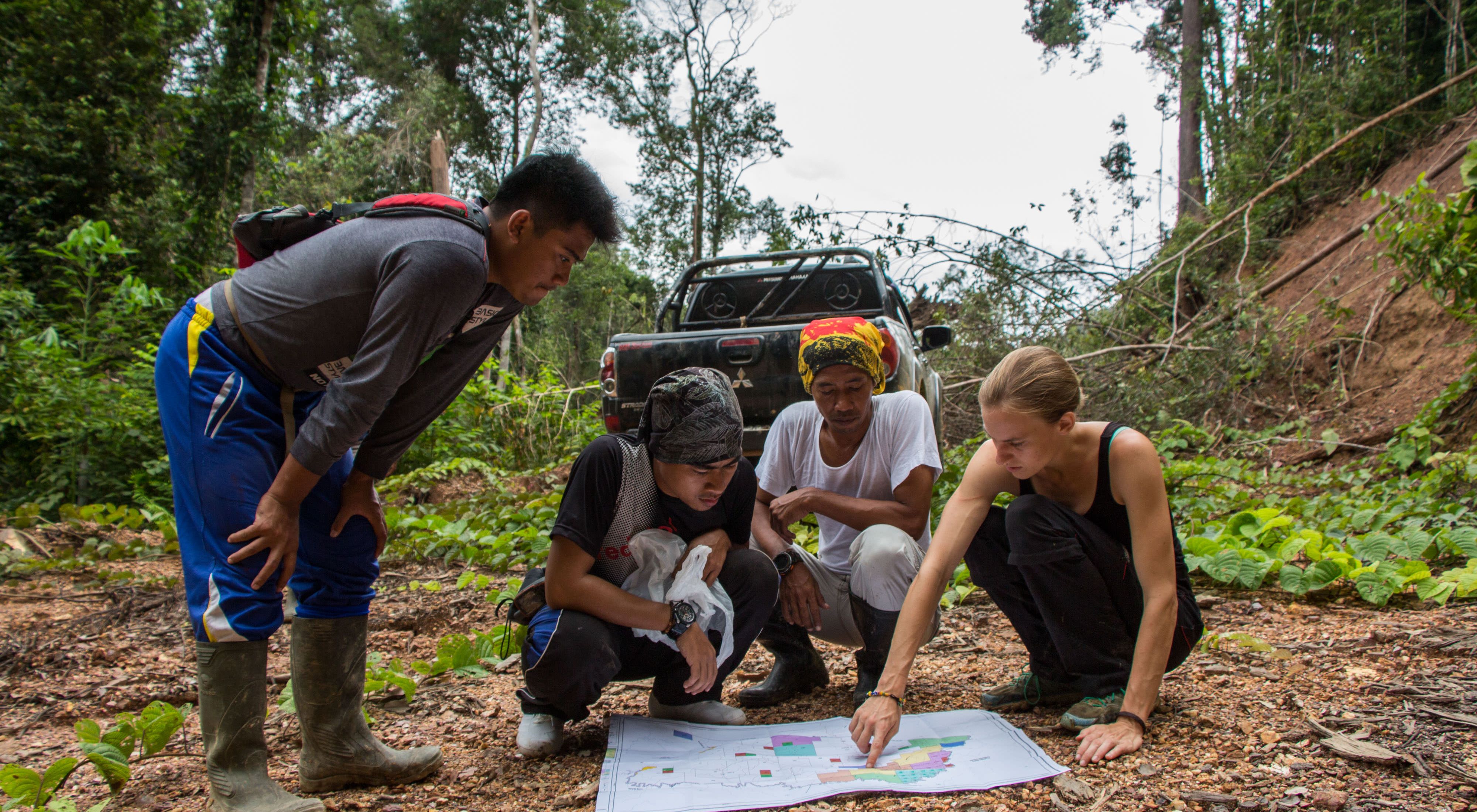 NatureNet Science Fellow Zuzana Burivalova working with local community members in Indonesia on a project using sound to monitor the health of a tropical forest.