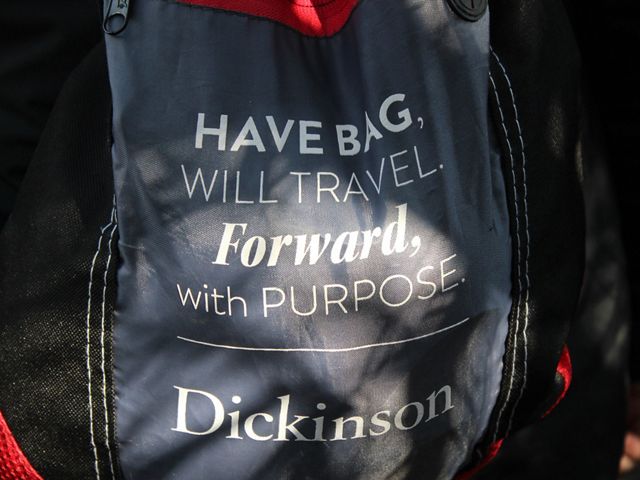 Backpack with inspirational message written on it: "Have bag, will travel forward, with purpose. Dickinson."