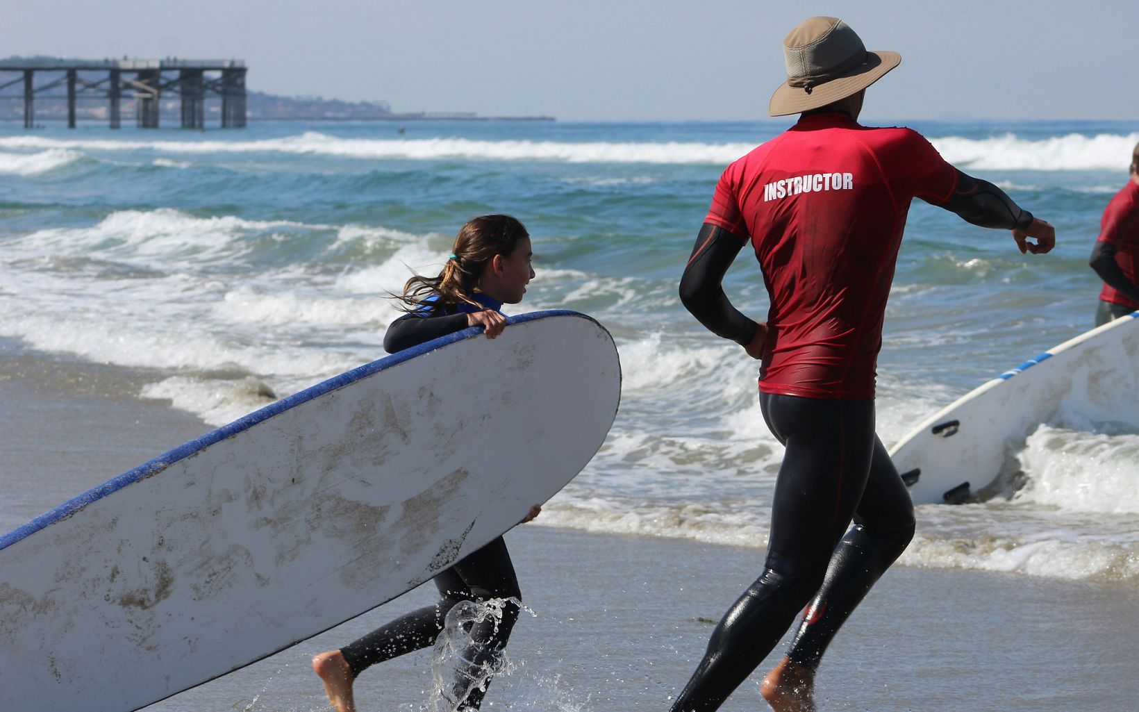 A girl learns to surf on the coast of Southern California