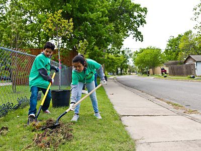 Children take part in a tree planting in Dallas, Texas.