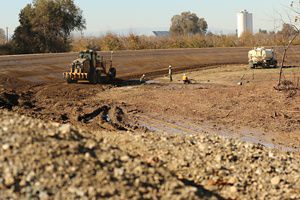 A tractor drives along the levee in Hamilton City.