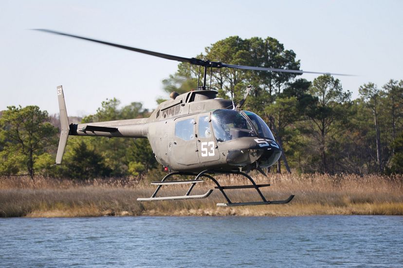 A US Navy helicopter flies low over a body of water on the Maryland coast during a training exercise.