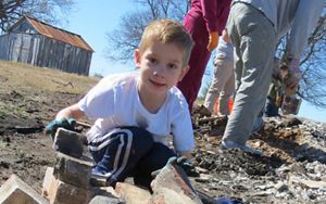 Girl holding crawfish.
