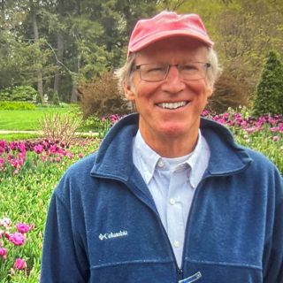 A photo of Jeff Rettig in a garden.