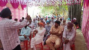 A group of people gathered together listening.