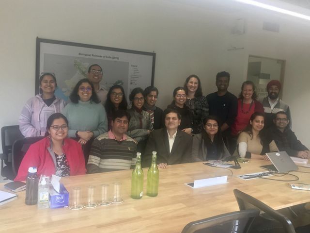 Elizabeth poses with the team on her first day in the office.
