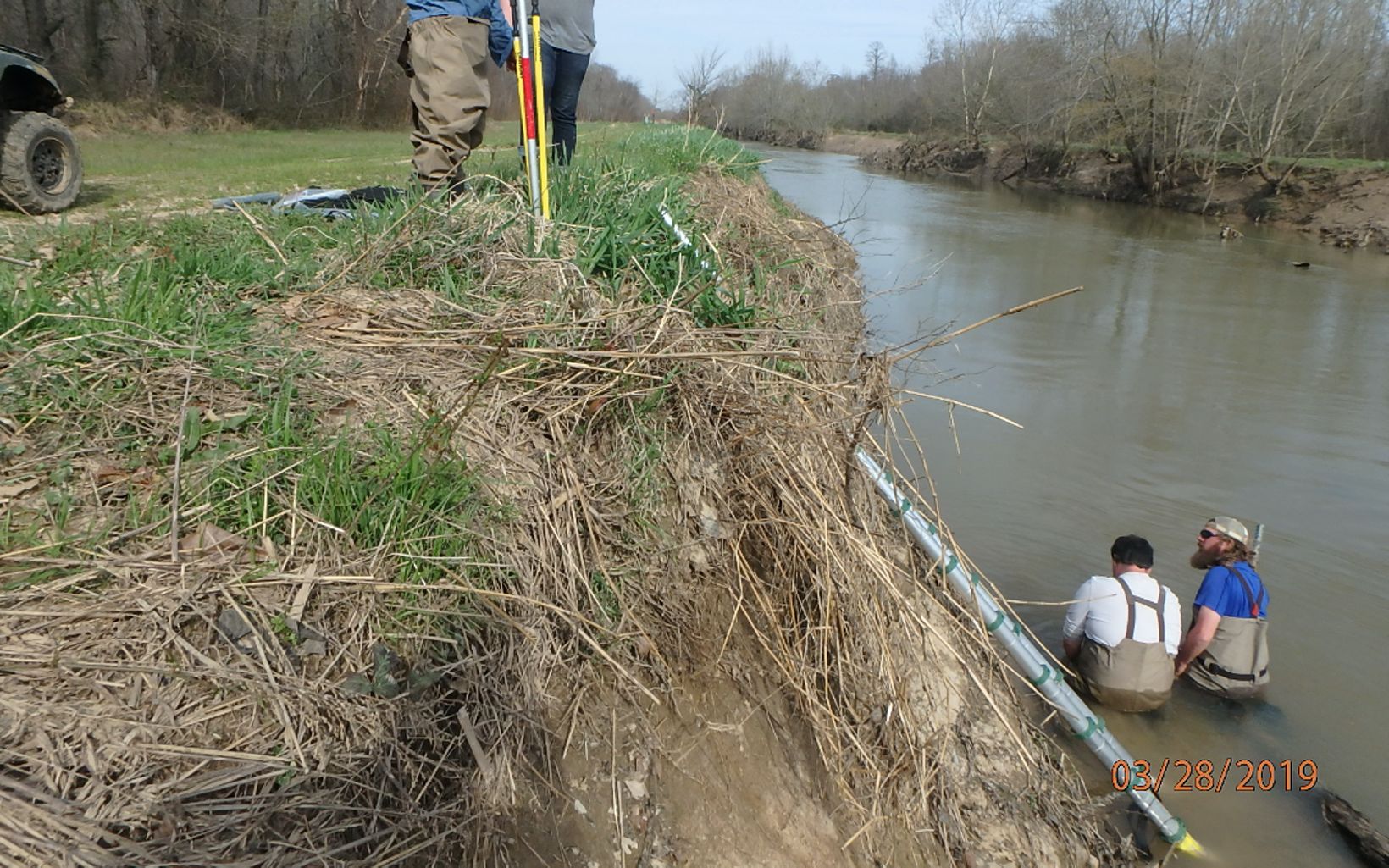 Installing Sensors Researchers install water level sensors in Mayfield Creek. © TNC