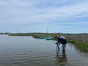 Keegan filming on the water.