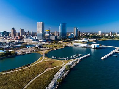 An aerial view of the Milwaukee skyline and surrounding waters.