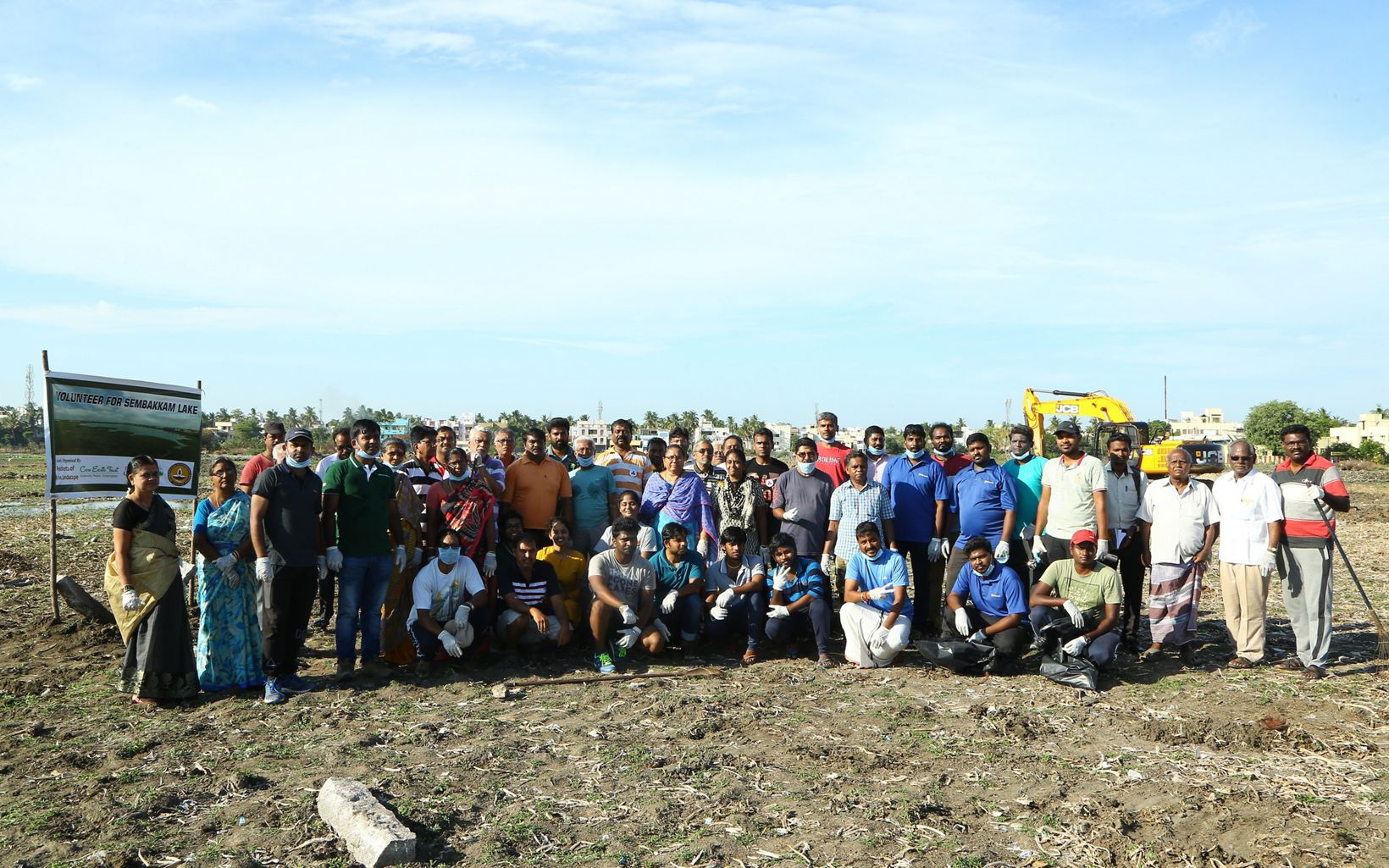 volunteers along with the project team gathered for the Lake Sembakkam clean up drive