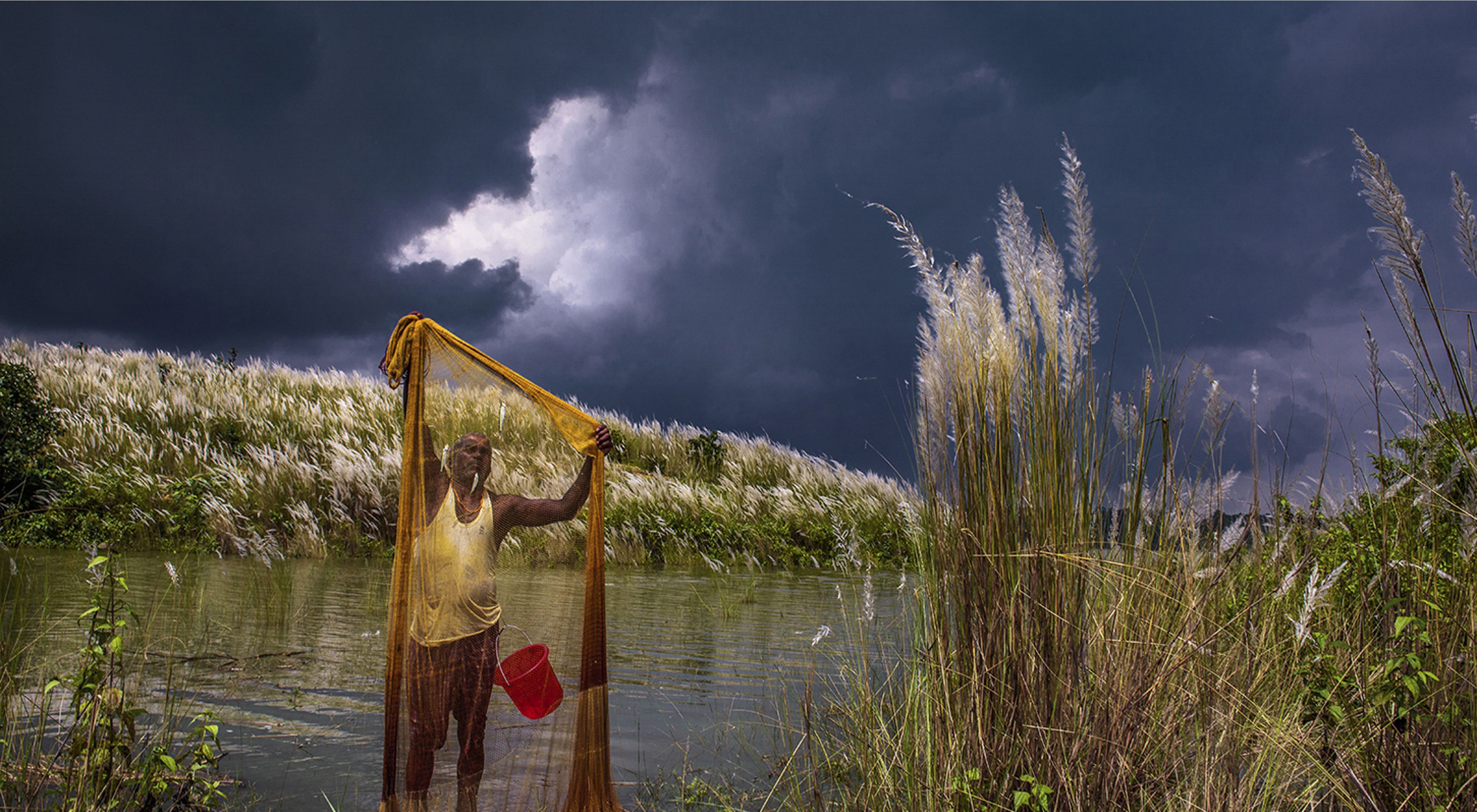 searches his net while storm clouds gather 