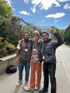 Three canvassers pose under the bright blue sky in Seattle. 
