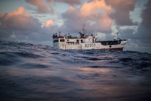 Water-level view of a fishing boat rocking on the ocean in Palau.