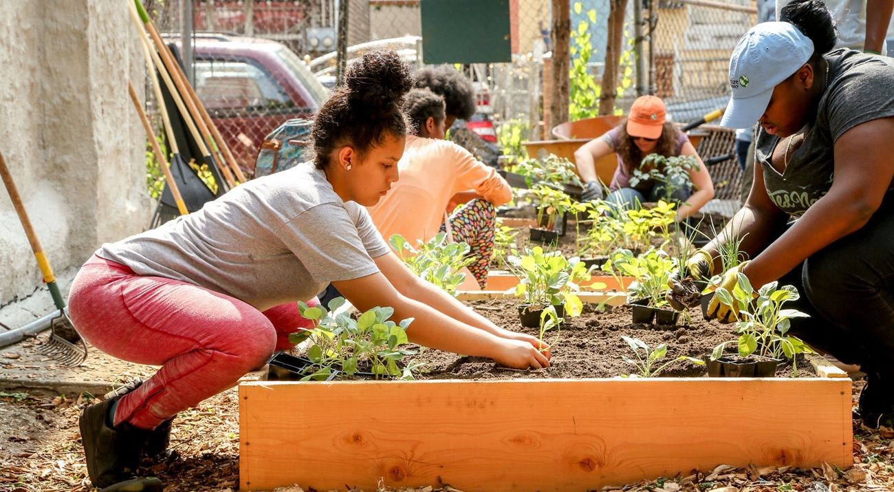 Young girl gardening.