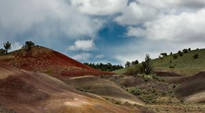 Red, rocky hills with scrubby vegetation.