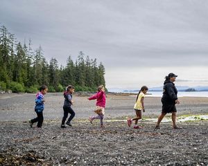 Paulette Jackson, an adult leader at the Kake Culture Camp, leads youth from one activity to the next.
