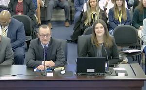 TNC in Kentucky's State Director, David Phemister and Director of External Affairs, Heather Jeffs, sit at a table, testifying during a committee meeting at the Kentucky state capital.