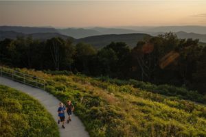 Children run on a path in a protected, conservation area in Kentucky.
