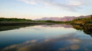 River with mountains in the distance.