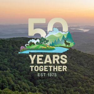 Kentucky's Appalachian Mountains with the graphic for our 50th Anniversary superimposed on the image.