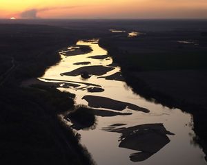 Aerial view of winding river with many sandbars.