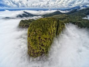 Aerial view of mist coming off high mountains.