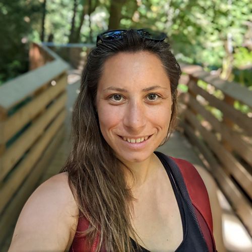 Person standing in forest.