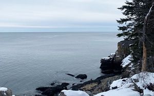 A view of the ocean from a rocky shore.