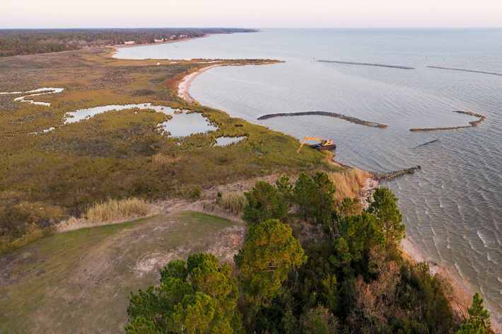 Water and land meet along a coastline.