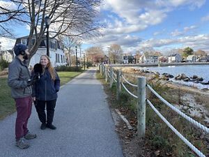 Podcast producer Jay interviews Julia Knisel from CZM standing on the walking path along the living shoreline at Collins Cove.