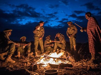 Lion Landscapes’ Lion Rangers gather around the fire.