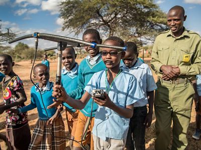 Lion Landscapes' Thomas Mojong teaches Ewaso Primary school students about lions.
