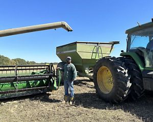 Farmer Roger Smith takes a break from harvesting soybeans.