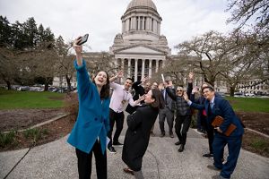A group of people taking a picture. 