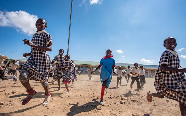 Students run into the schoolyard at Amani School, Lakipia County, Kenya. 