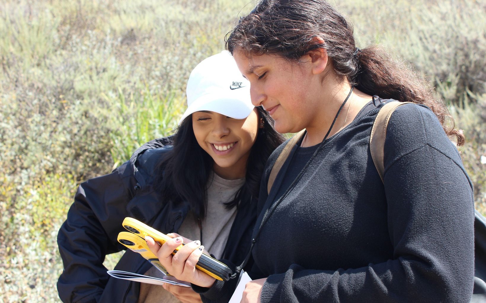 
                
                  Environmental Education Lompoc High School students experiment with GPS technology on a visit to the preserve.
                  © TNC
                
              